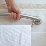 hand holding the plus towel bar