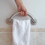 hand holding the towel ring