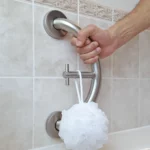 hand holding a towel hook