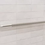 36-inch knurled Easy Mount grab bar on a tiled wall