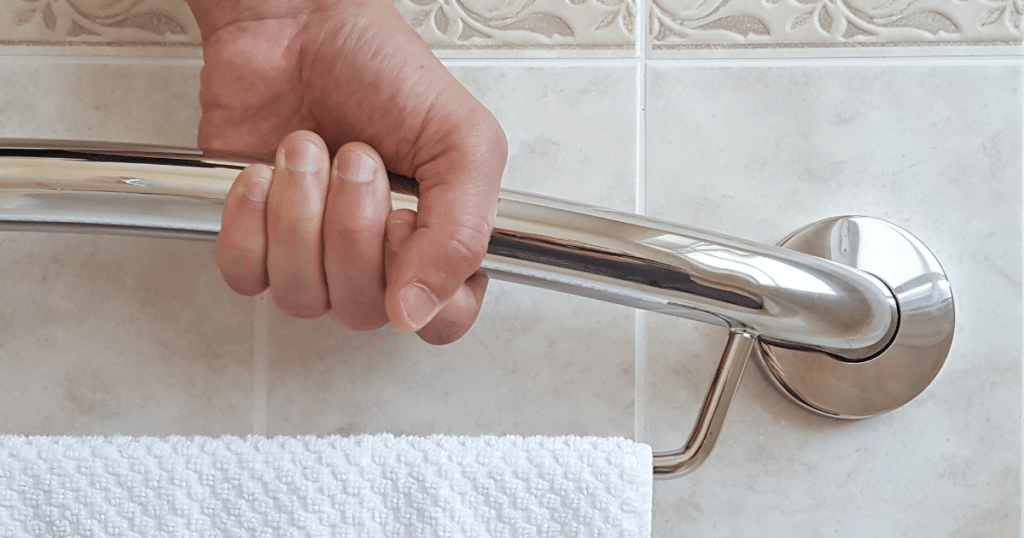 Hand holding onto the plus towel bar