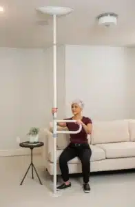 woman using the upole with bar getting off the couch